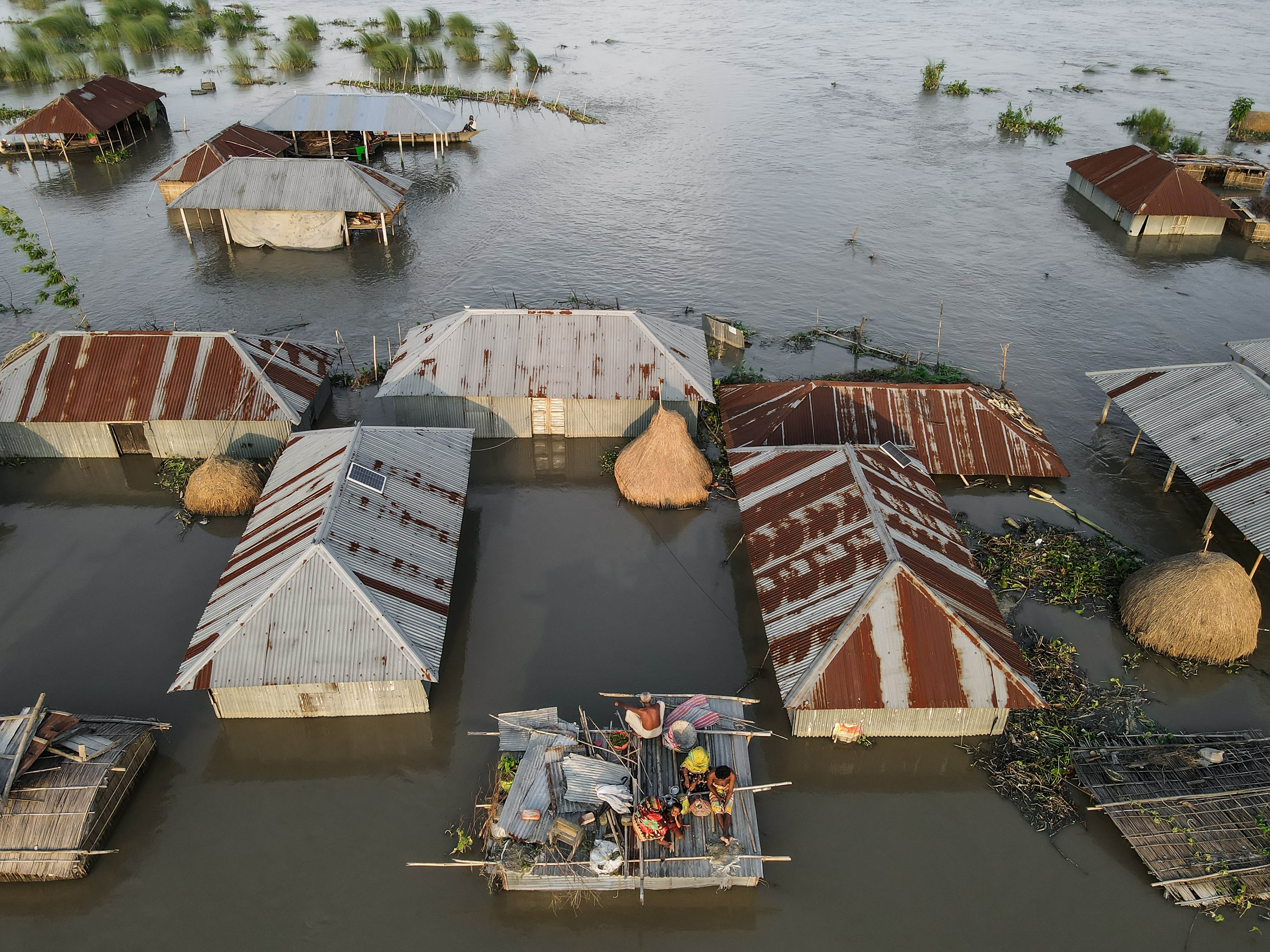 Photographer: Muhammad Amdad Hossain Location: Kurrigram, Bangladesh, showing flooded areas with submerged houses.